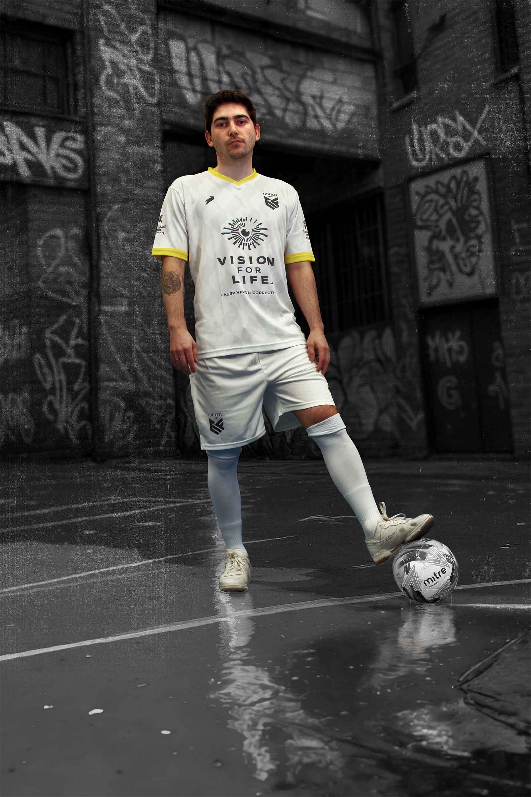 Male player standing on ball.